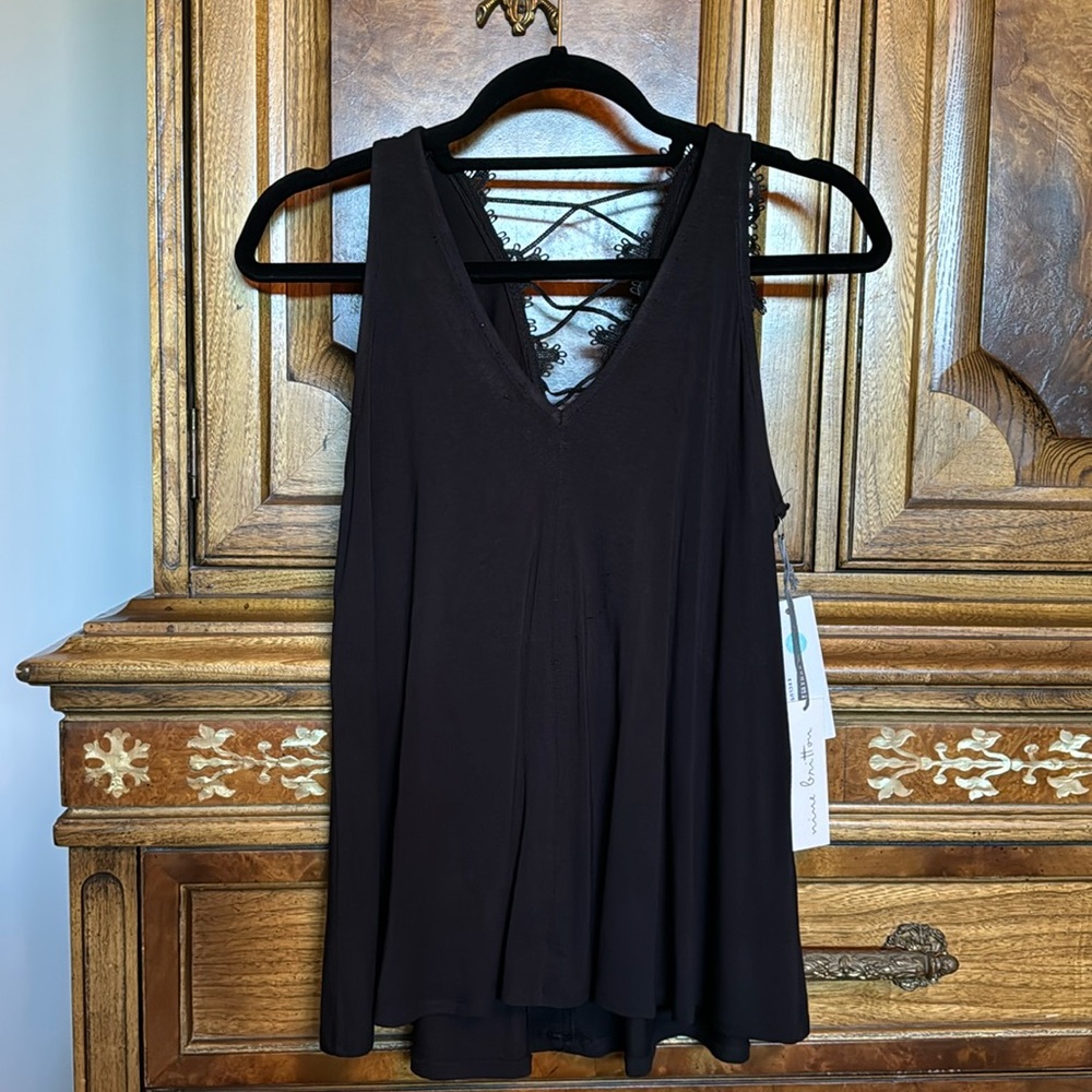 Dressy, flowy black tank with back lane detail.